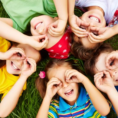 Children resting Group of cute children lying on grass